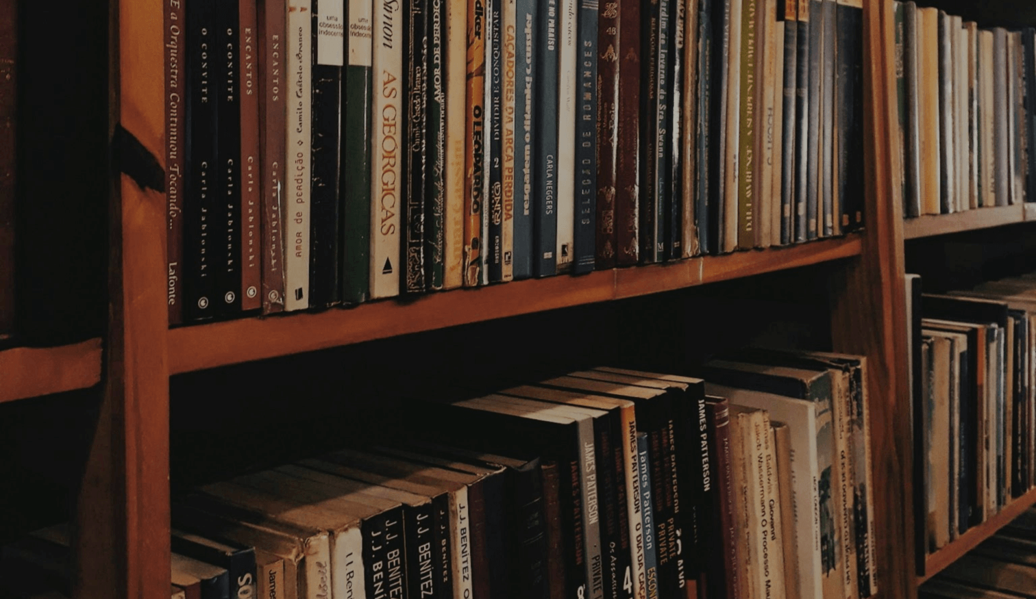 A wooden bookshelf filled with books.